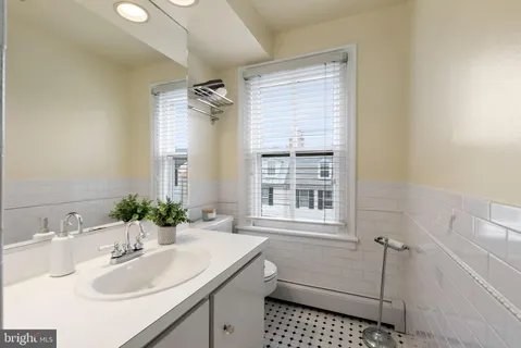 a view of backyard with seating area and trees