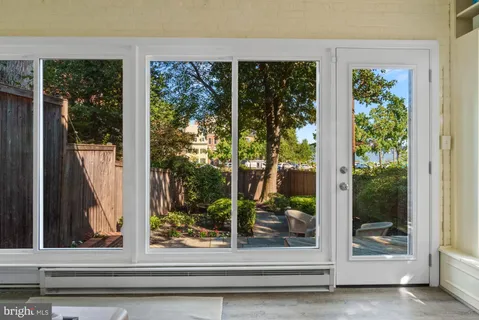 a kitchen with a sink stove top oven and cabinets