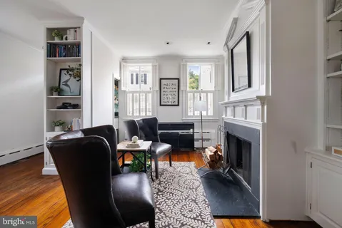 a view of empty room with cabinet and rug
