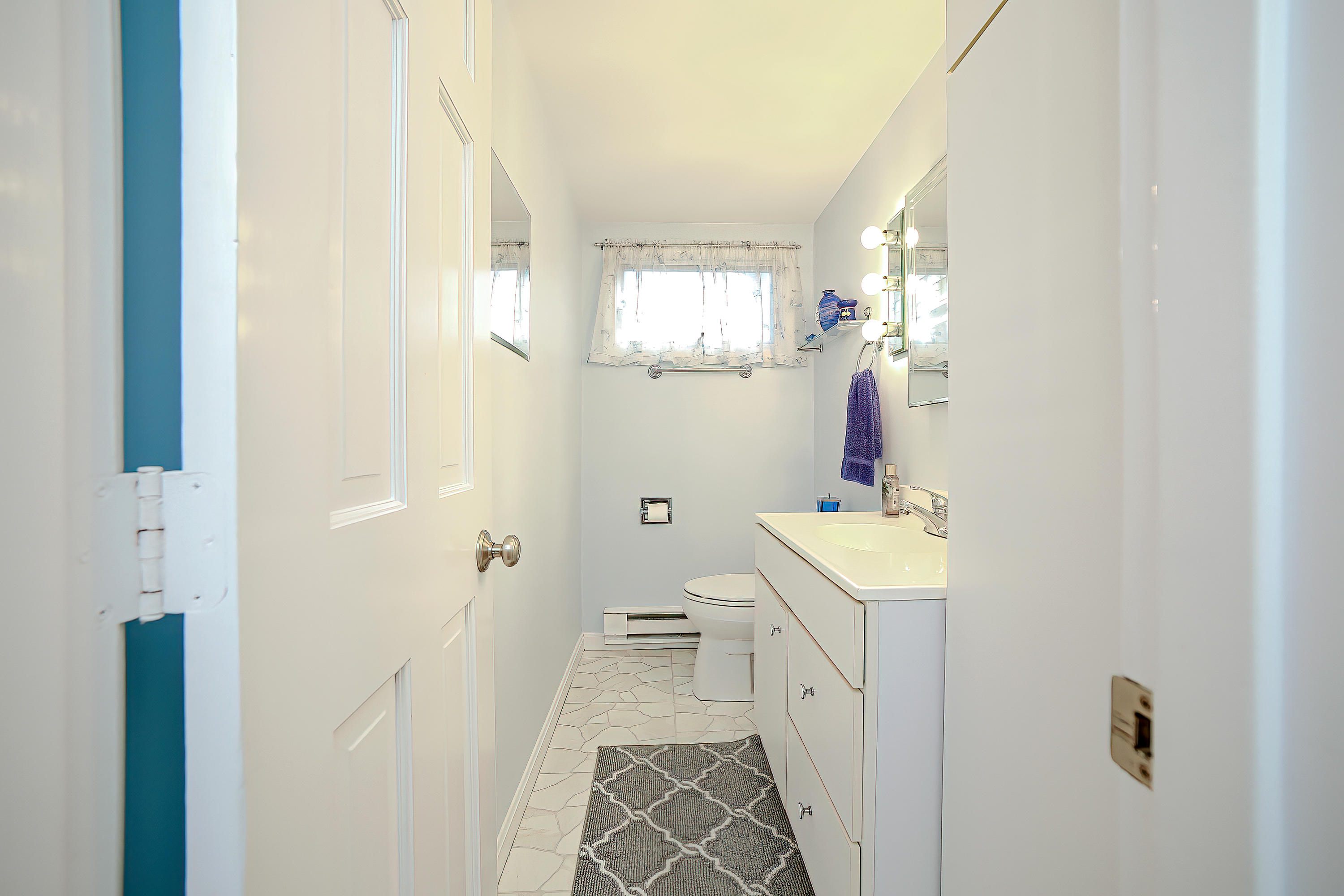 46 Delta Street Hyannis, MA 02601 - Photo 13 of 35 a bathroom with a sink a toilet and shower