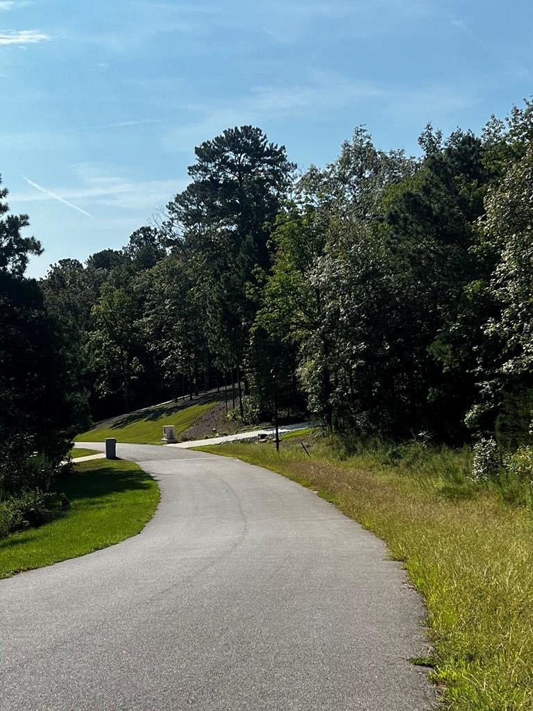 511 Sweetwater Drive Cataula, GA 31804 - Photo 4 of 6 a view of a swimming pool with an outdoor space and seating area