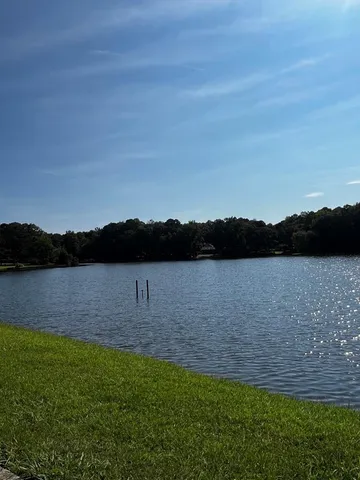 a view of lake from top of residential house and outdoor space