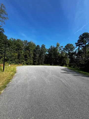 a view of a lake with a yard