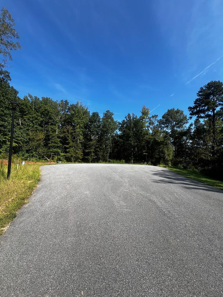 511 Sweetwater Drive Cataula, GA 31804 - Photo 6 of 6 a view of a lake with a yard