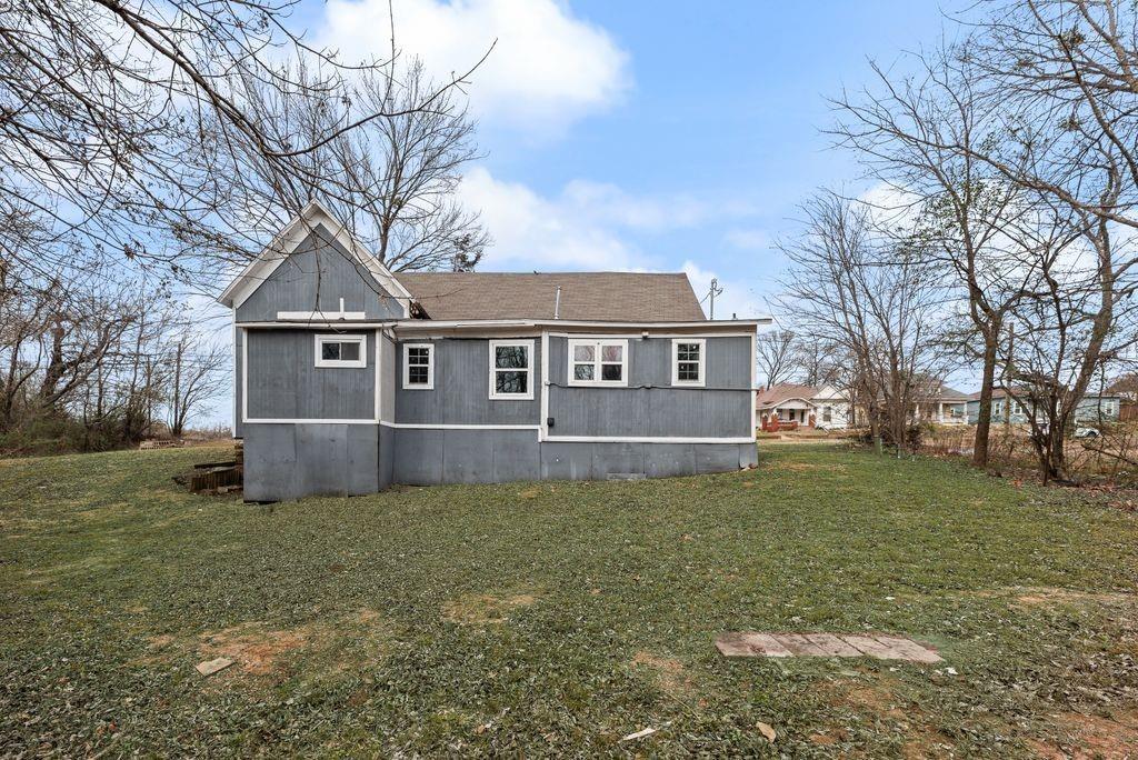 500 East Main Street Denison, TX 75021 - Photo 21 of 21 Back of house featuring a yard