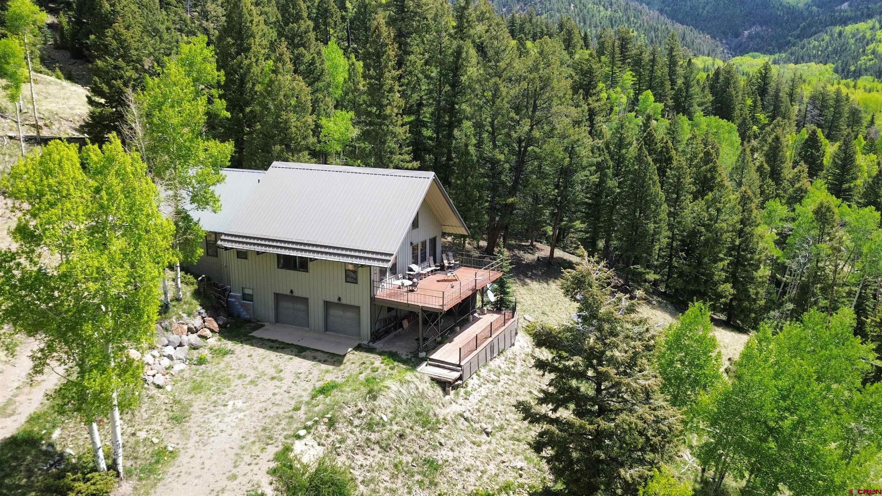1113 Spring Street Del Norte, CO 81132 - Photo 4 of 43 an aerial view of a house with yard and outdoor space