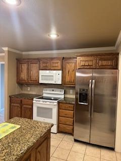 6801 Mosley Street Amarillo, TX 79119 - Photo 5 of 12 a kitchen with granite countertop a sink and stainless steel appliances