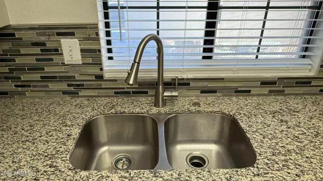 an empty room with closet and a bathroom