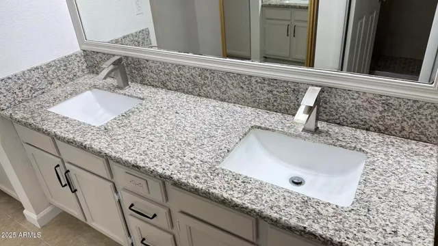 a view of a house with garden and sitting area