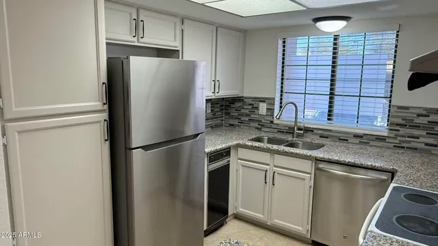 an empty room with a empty space and windows