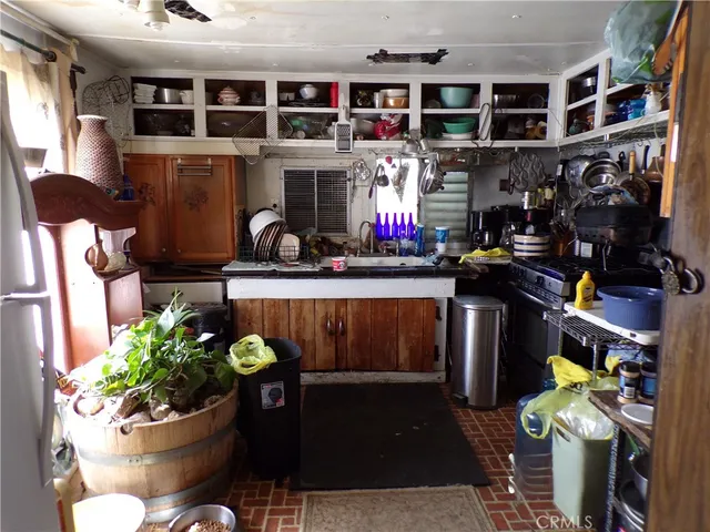 a room with storage and a potted plant