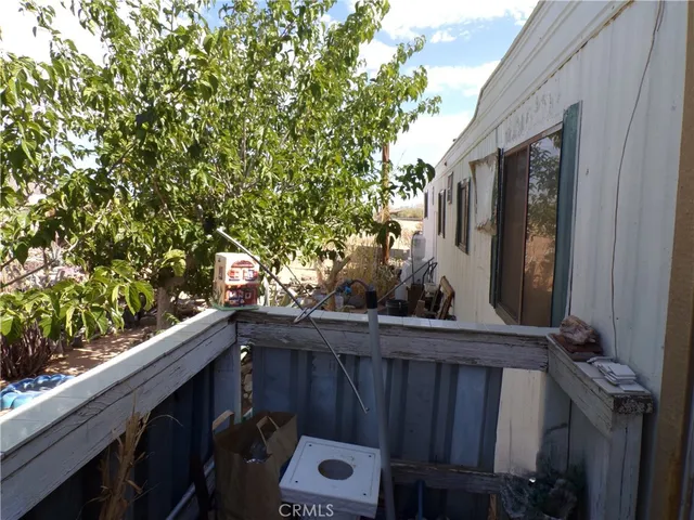 a view of a balcony with an outdoor space
