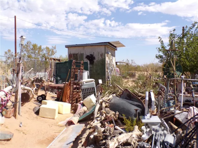 a view of a balcony with furniture and a potted plant