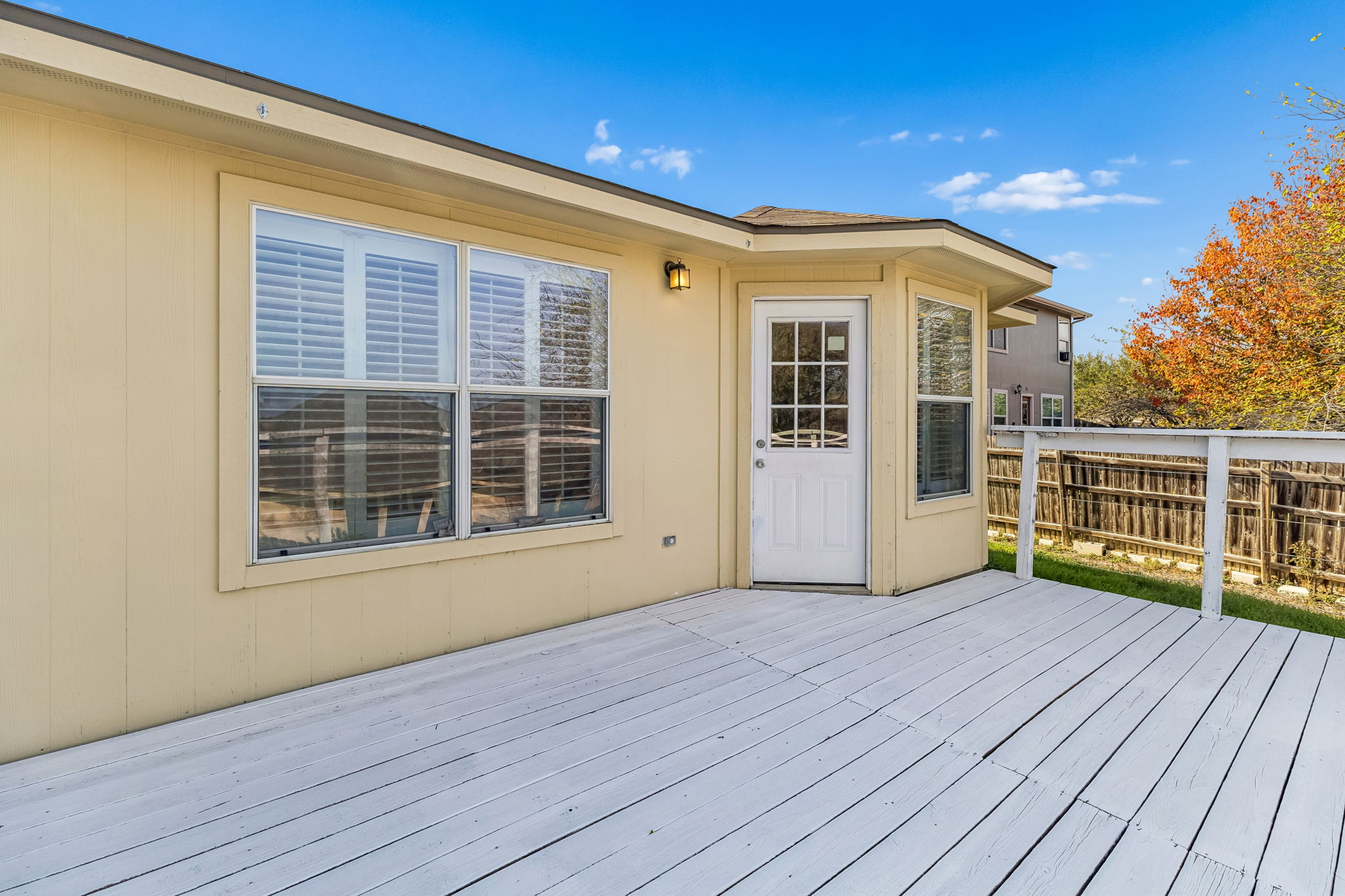1148 Amberwood Loop Kyle, TX 78640 - Photo 21 of 22 a view of a house with a wooden deck