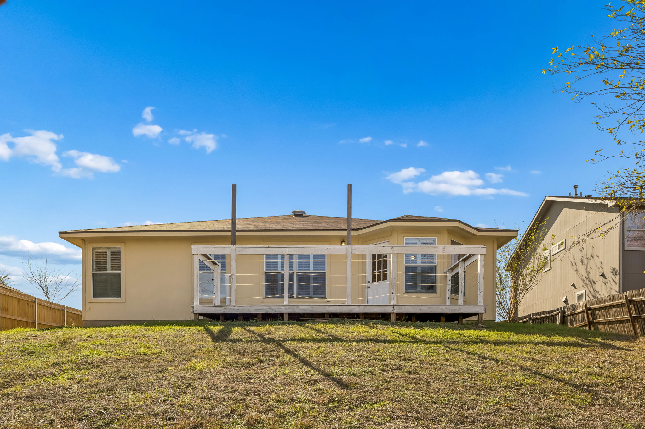 1148 Amberwood Loop Kyle, TX 78640 - Photo 22 of 22 a front view of a house with a yard
