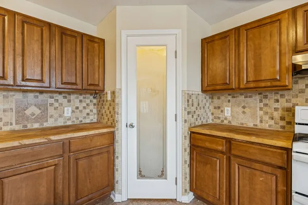 a view of a kitchen with electric appliances
