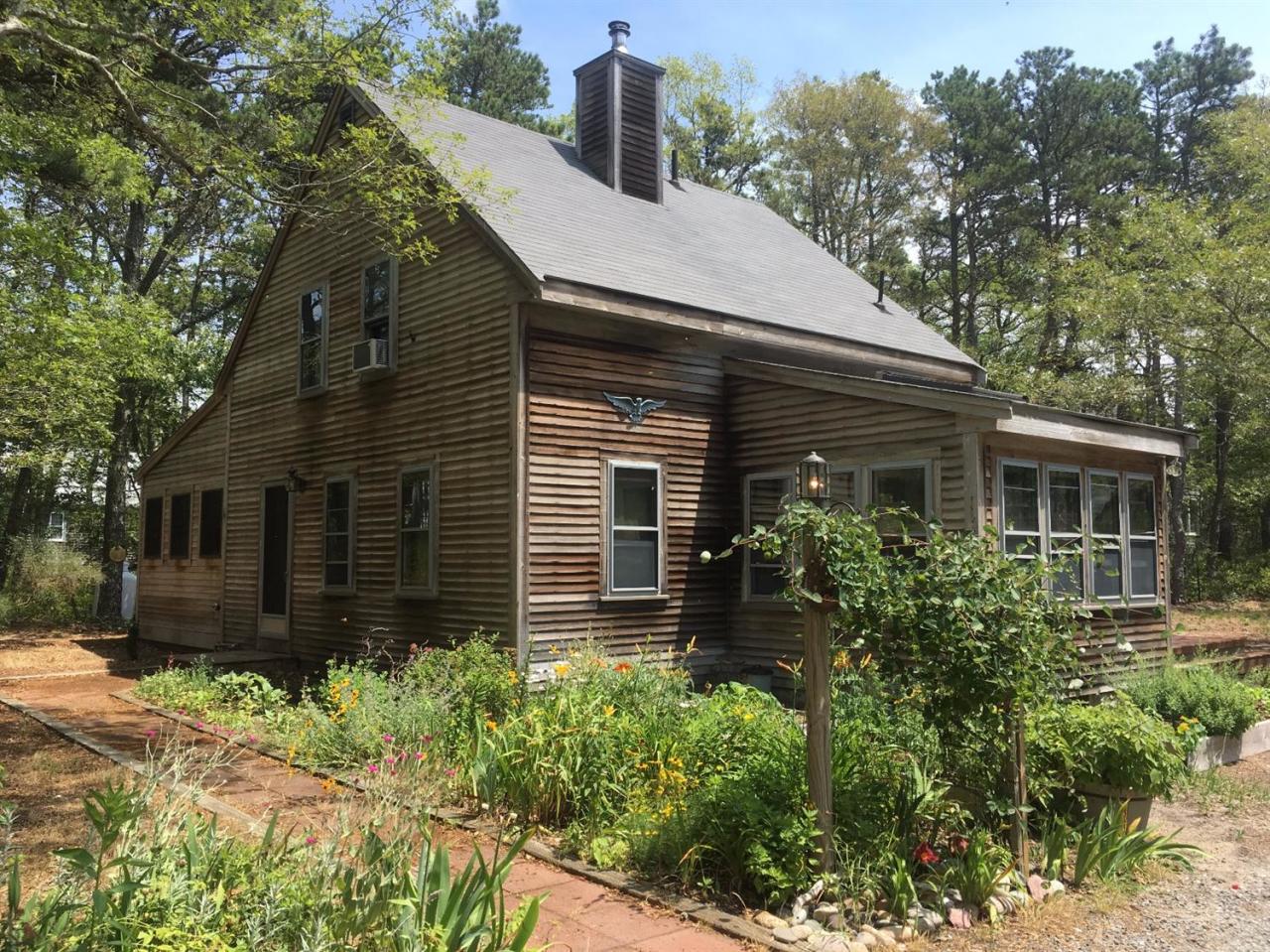 150 Gross Hill Road Wellfleet, MA 02667 - Photo 1 of 31 front view of a house with a yard