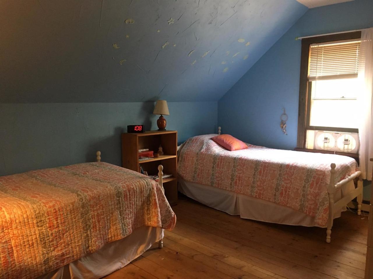 150 Gross Hill Road Wellfleet, MA 02667 - Photo 13 of 31 a bedroom with a bed and window