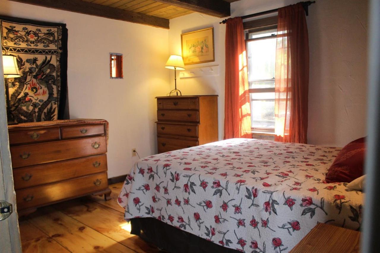 150 Gross Hill Road Wellfleet, MA 02667 - Photo 14 of 31 a bedroom with a bed and a dresser