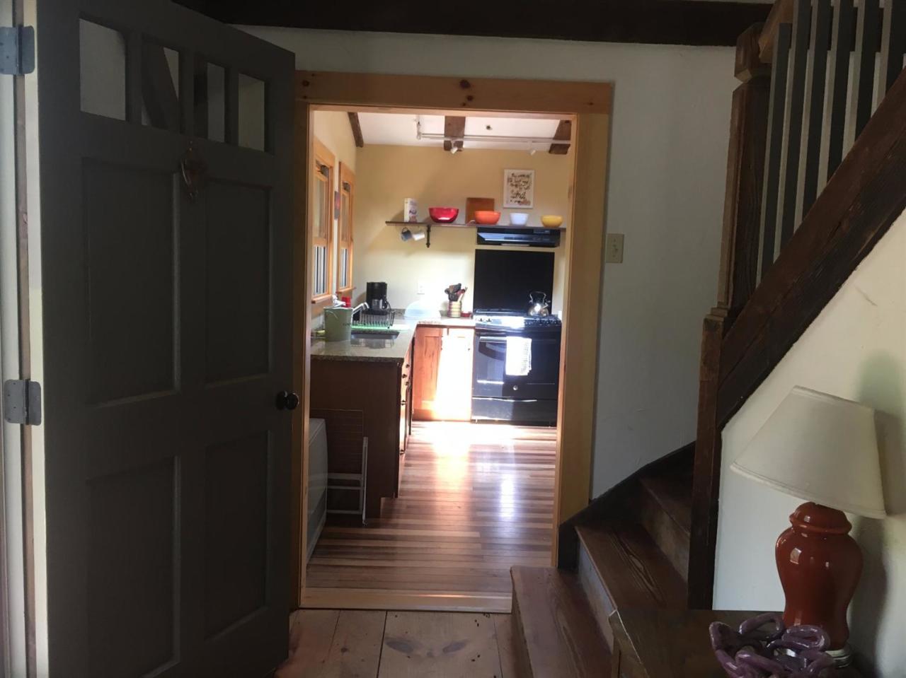 150 Gross Hill Road Wellfleet, MA 02667 - Photo 16 of 31 a view of a hallway with dining room and wooden floor