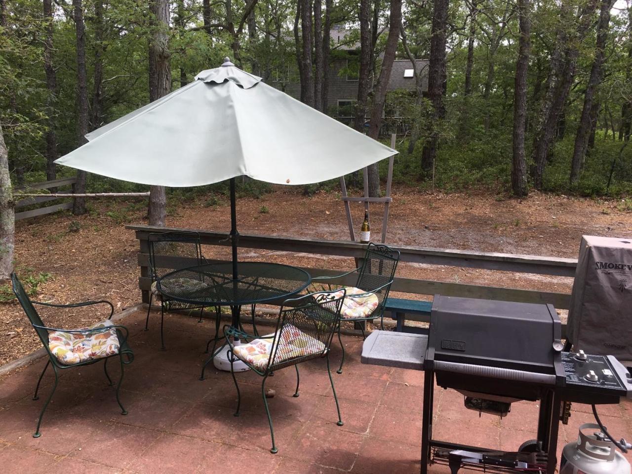 150 Gross Hill Road Wellfleet, MA 02667 - Photo 19 of 31 a terrace of a house with outdoor seating