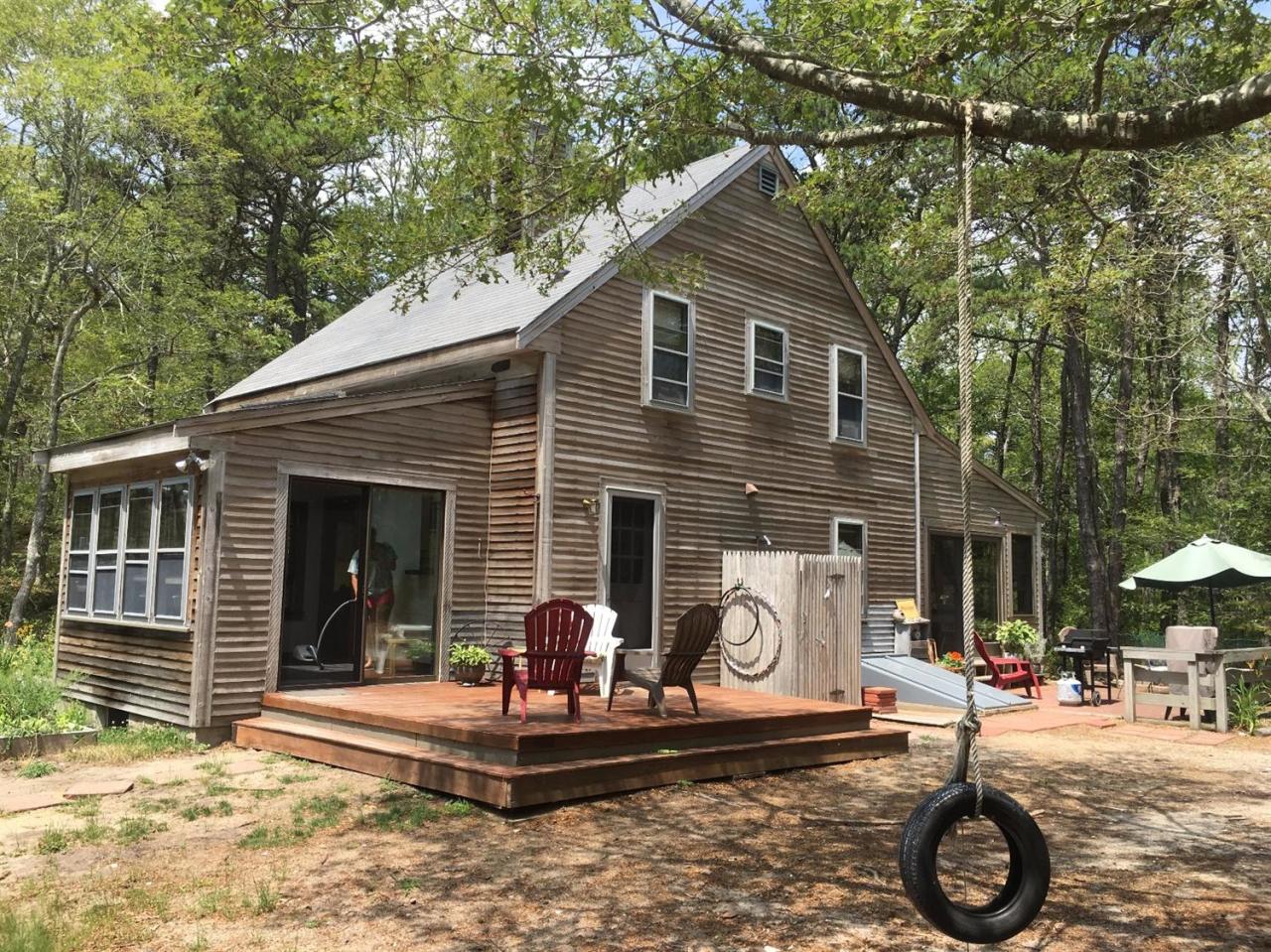 150 Gross Hill Road Wellfleet, MA 02667 - Photo 2 of 31 a front view of a house with garden