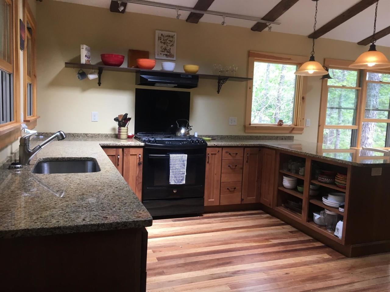 150 Gross Hill Road Wellfleet, MA 02667 - Photo 4 of 31 a kitchen with stainless steel appliances granite countertop a sink stove and cabinets