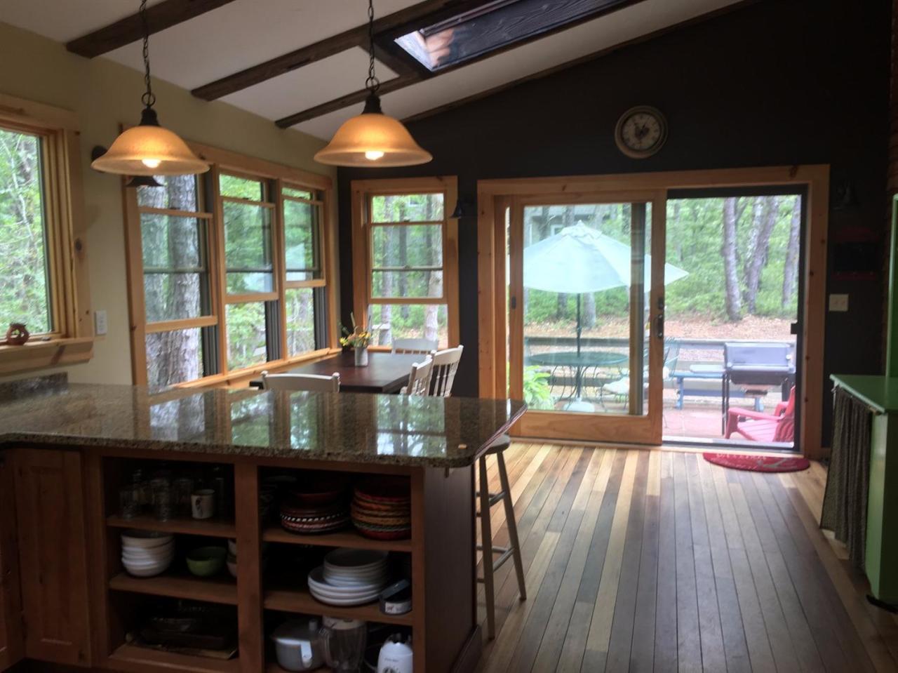 150 Gross Hill Road Wellfleet, MA 02667 - Photo 5 of 31 a view of a room with wooden floor and furniture