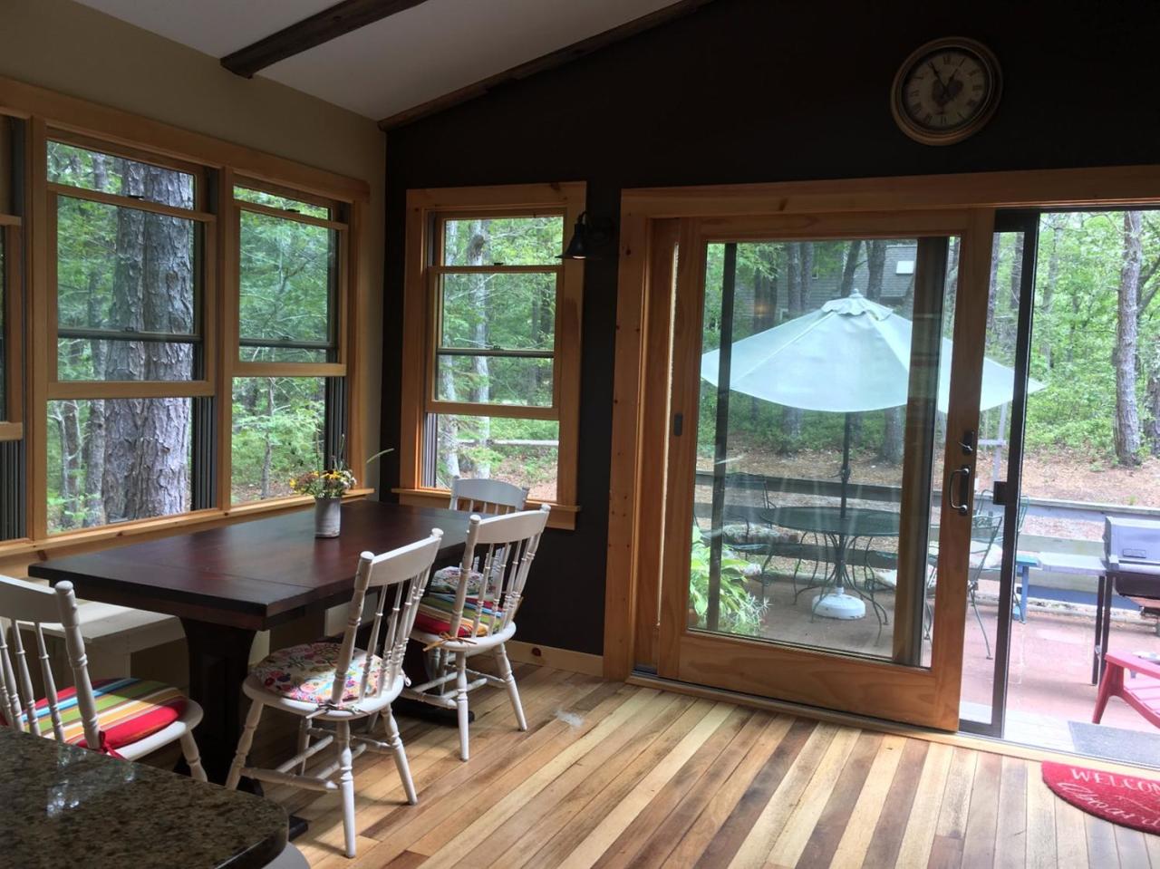 150 Gross Hill Road Wellfleet, MA 02667 - Photo 8 of 31 a dining room with furniture and a floor to ceiling window