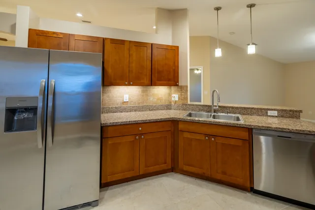 a bathroom with a sink double vanity and a shower