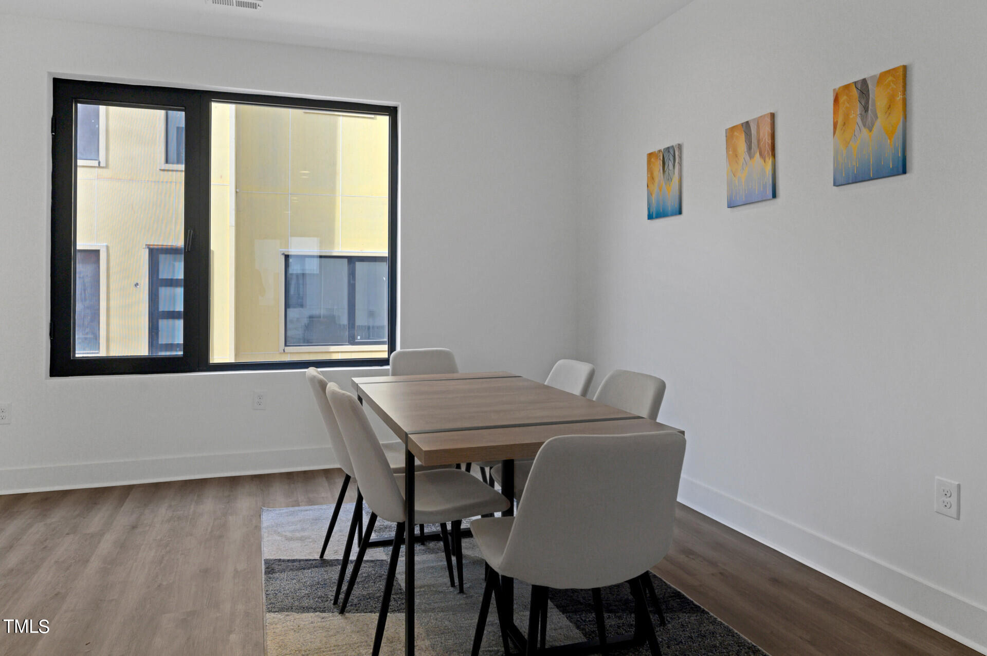 1202 Nova Street Durham, NC 27713 - Photo 3 of 26 a view of a dining room with furniture and wooden floor