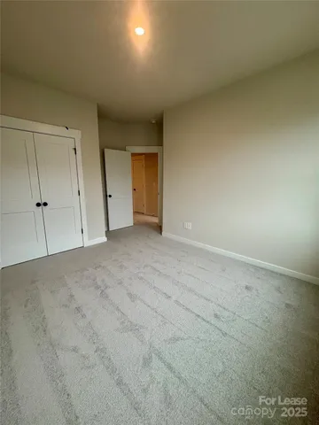 a view of an empty room and a window