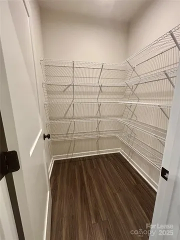 a view of a room with racks on the wall