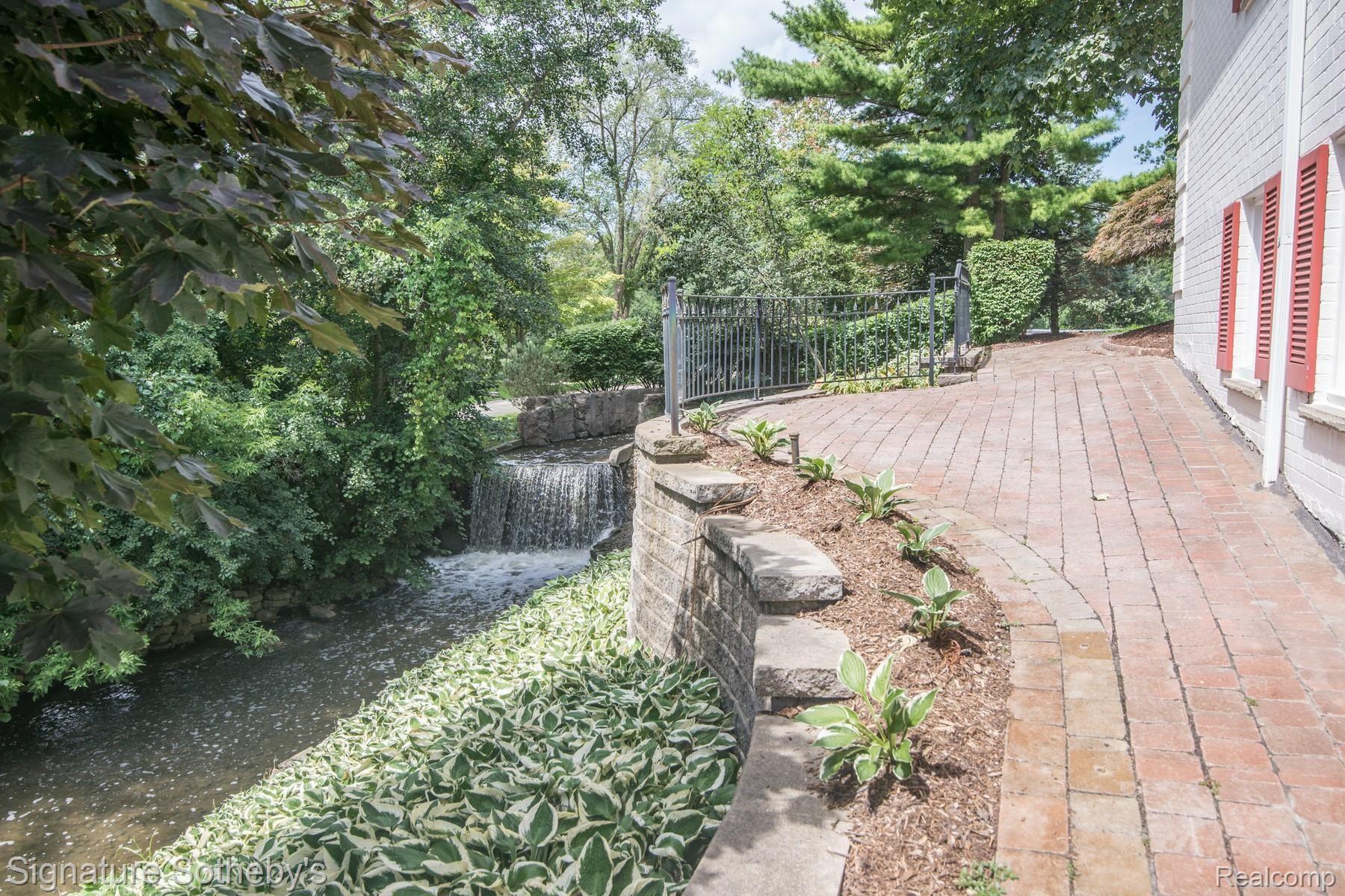 172 Chesterfield Road Bloomfield Hills, MI 48304 - Photo 78 of 98 039_41.jpg Private brick walkway along waterfall for peaceful view