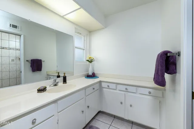 a bathroom with a sink and mirror