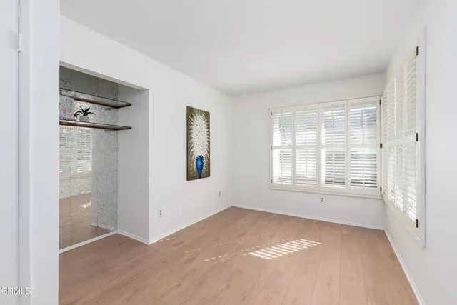 a view of an empty room with a window