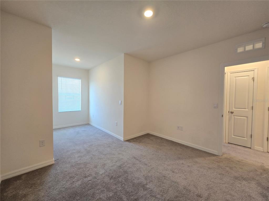 32803 Pez Landing Lane Wesley Chapel, FL 33543 - Photo 13 of 23 a view of an empty room