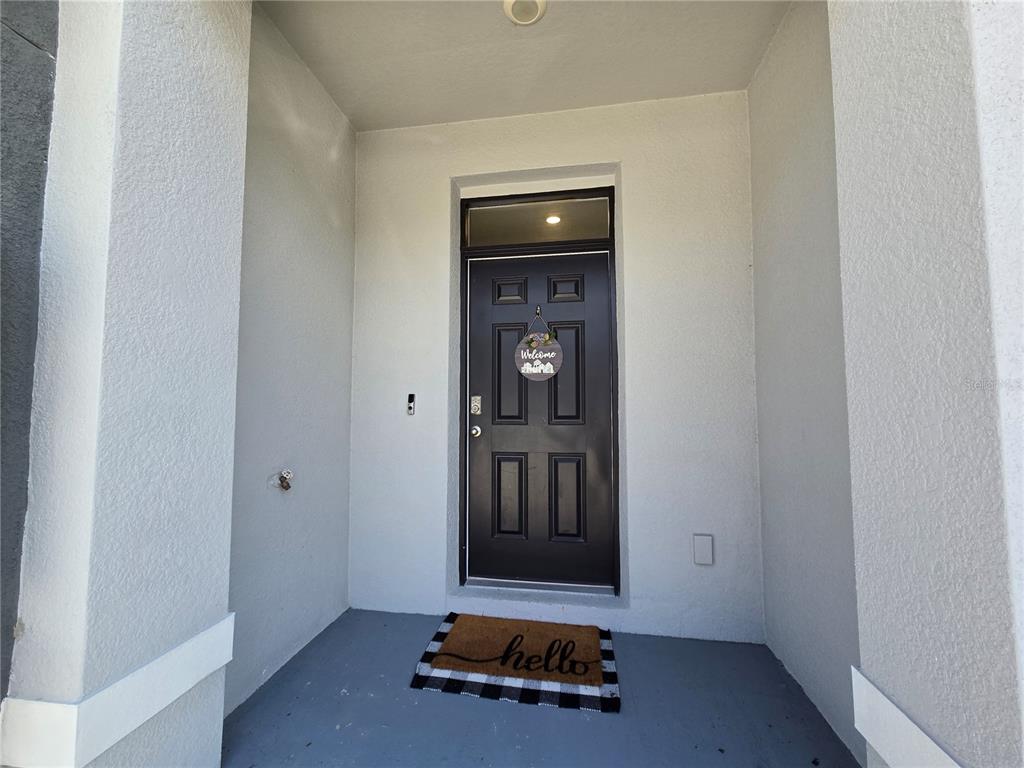 32803 Pez Landing Lane Wesley Chapel, FL 33543 - Photo 18 of 23 a room with window and wooden floor