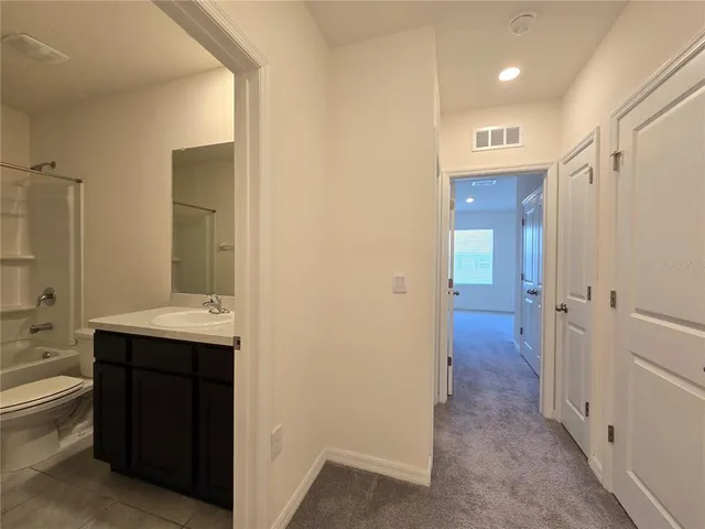 a bathroom with a sink and mirror