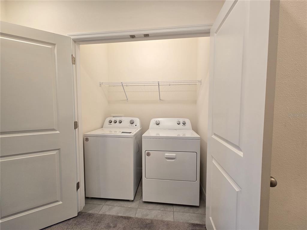 32803 Pez Landing Lane Wesley Chapel, FL 33543 - Photo 10 of 23 a utility room with dryer and washer
