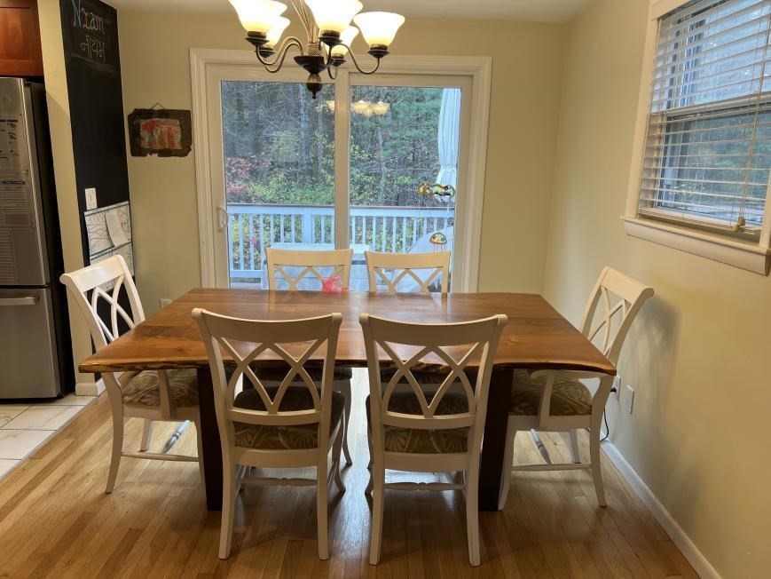 27 Burlington Road Bedford, MA 01730 - Photo 5 of 8 a view of a dining room with furniture wooden floor and a chandelier