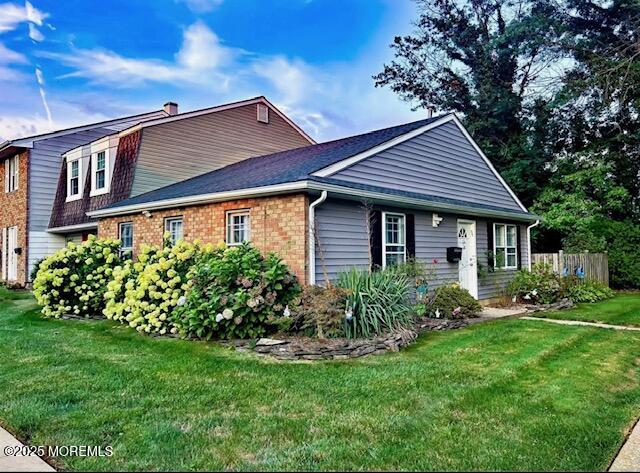 31 Kingsley Way Freehold, NJ 07728 - Photo 1 of 28 a front view of a house with a garden and plants