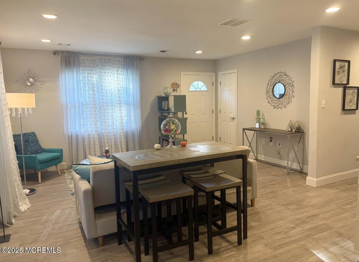 31 Kingsley Way Freehold, NJ 07728 - Photo 11 of 28 a view of a dining room with furniture and wooden floor