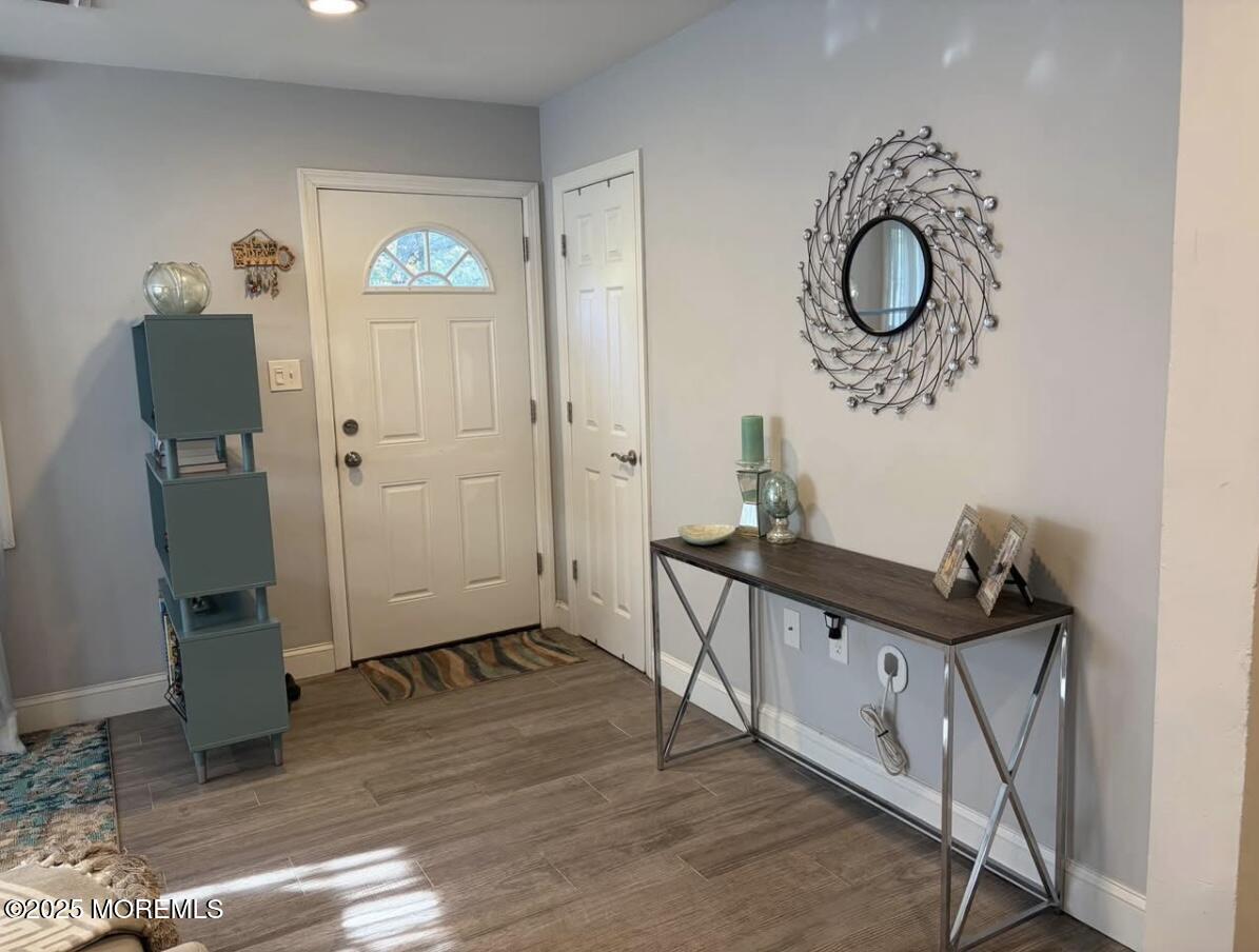31 Kingsley Way Freehold, NJ 07728 - Photo 14 of 28 a view of a hallway a dinning room and chandelier fan