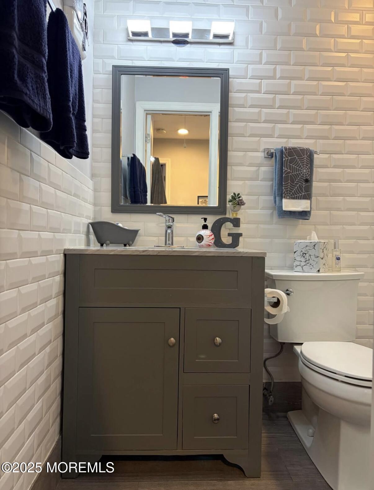 31 Kingsley Way Freehold, NJ 07728 - Photo 17 of 28 a bathroom with a granite countertop toilet sink and mirror