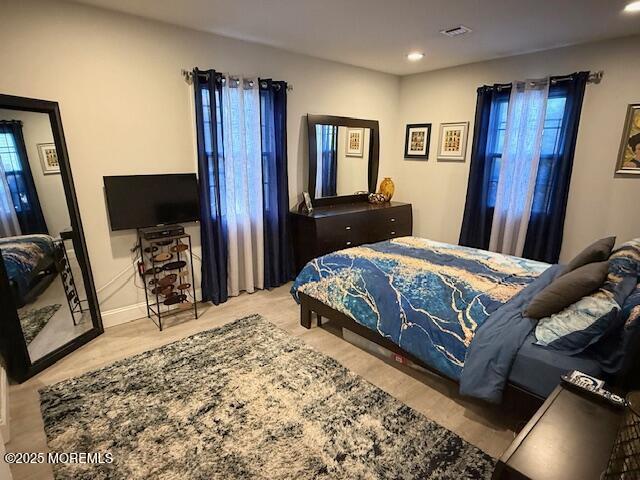 31 Kingsley Way Freehold, NJ 07728 - Photo 19 of 28 a bedroom with a bed and a flat screen tv