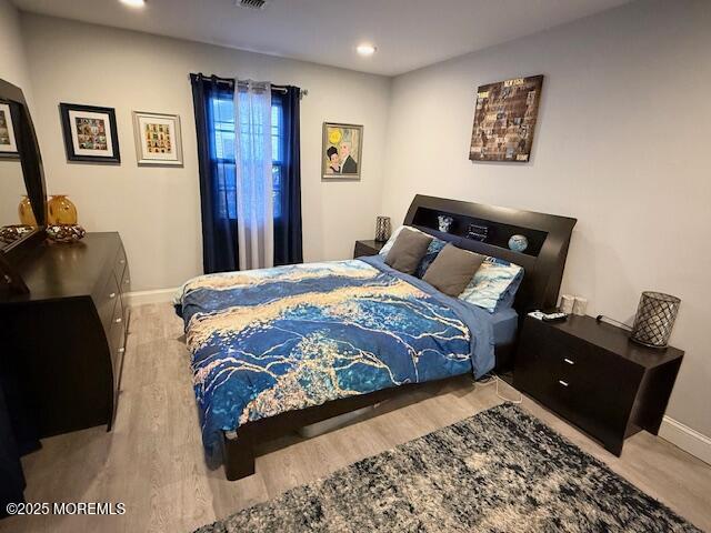 31 Kingsley Way Freehold, NJ 07728 - Photo 20 of 28 a bedroom with bed and painting on the wall