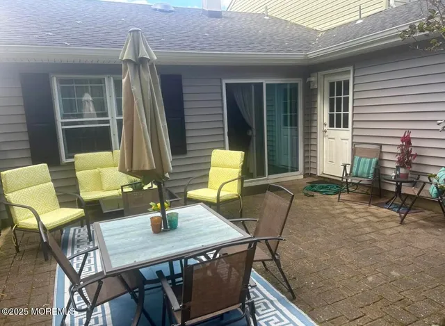 a view of yard with swimming pool and green space