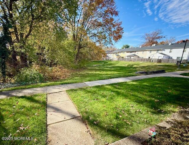31 Kingsley Way Freehold, NJ 07728 - Photo 26 of 28 a view of yard with swimming pool and green space