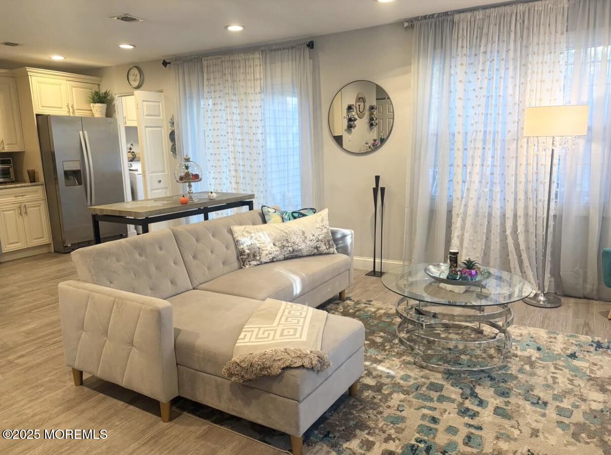 31 Kingsley Way Freehold, NJ 07728 - Photo 3 of 28 a living room with furniture and a large window